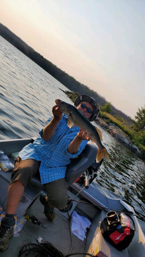 Fisherman holding Canadian Walleye at Halley's Camps Trapline Lake Outpost.