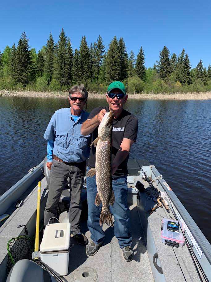 Rick and guide Brian fishing northern pike at Kettle Falls.