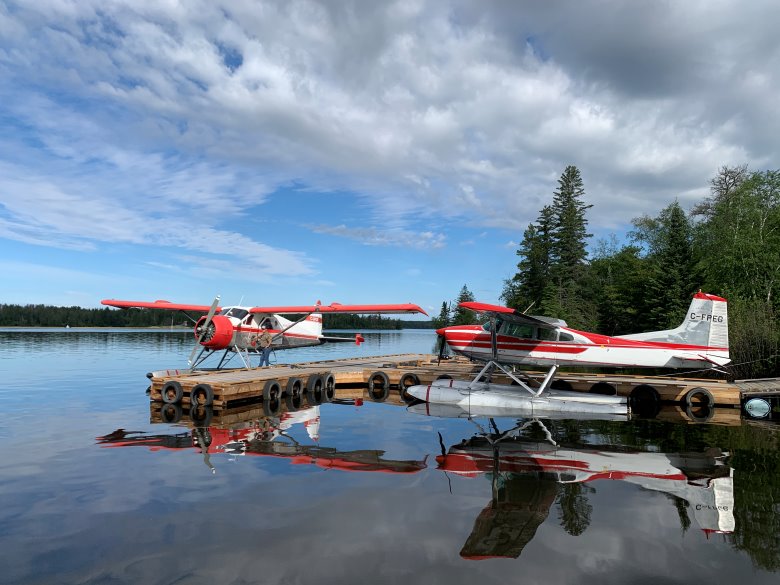 Halley's Camps Float planes parked at dock.