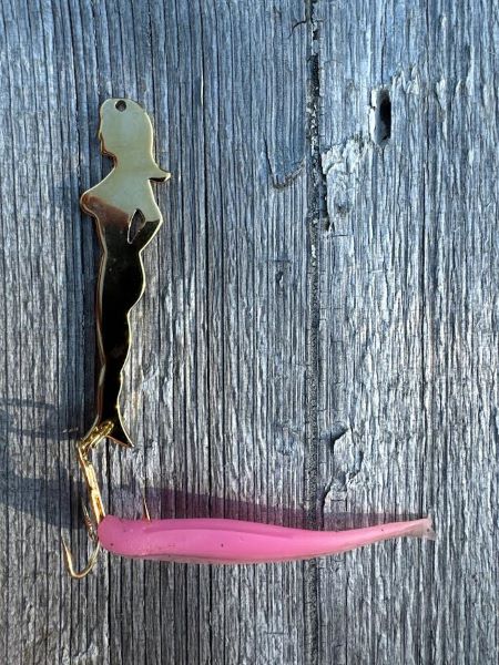 Lady silhouette fishing lure laying on the dock at Kettle Falls Lodge.