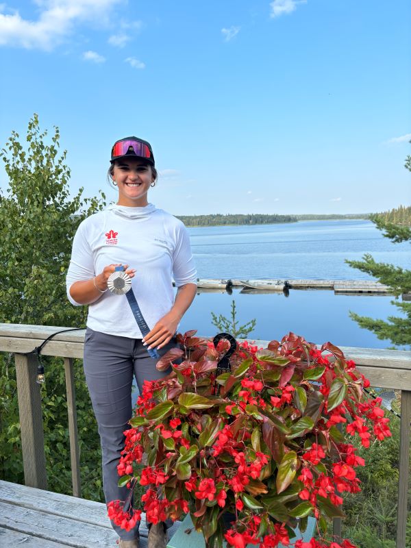 Abby Dent, Olympic Silver Medalist, with her medal at Kettle Falls Lodge