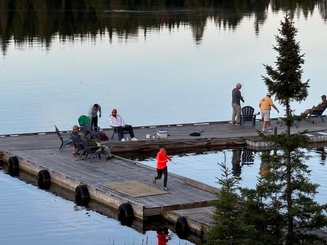 A bunch of fishermen fishing from the docks at Kettle Falls!