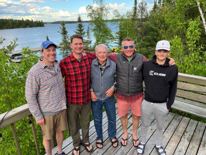 Family photo of a fishing group that comes annually to Kettle Falls Lodge.