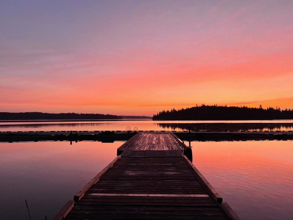 Sunrise photo at Kettle Falls Lodge in September-pinks, oranges and purple