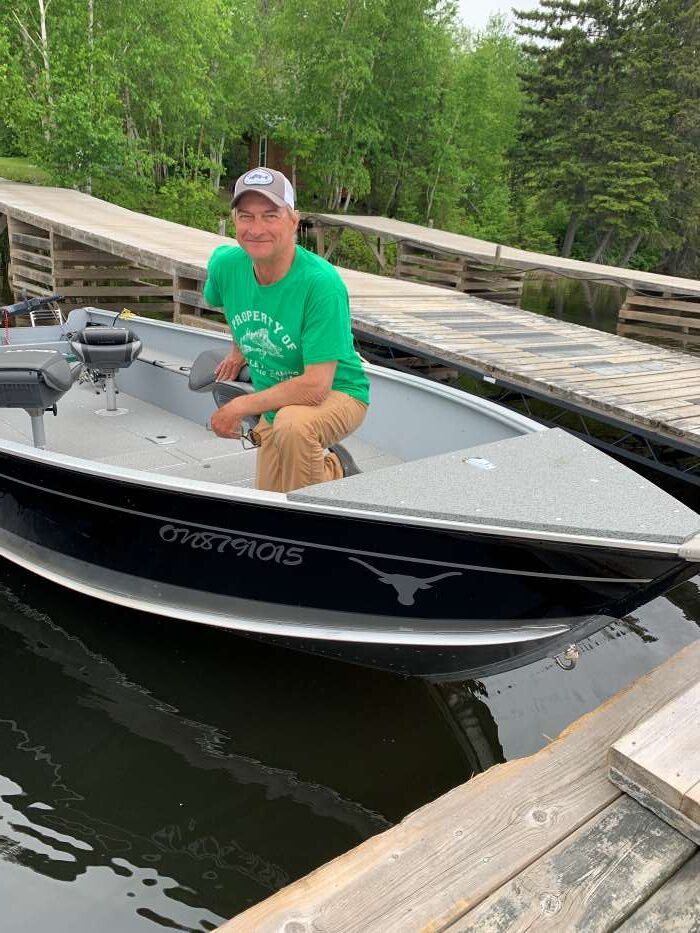 Head guide Jr at One Man Lake showing his new boat.