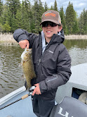 child holding smallmouth bass