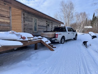 Truck parked out next to the new cabin.